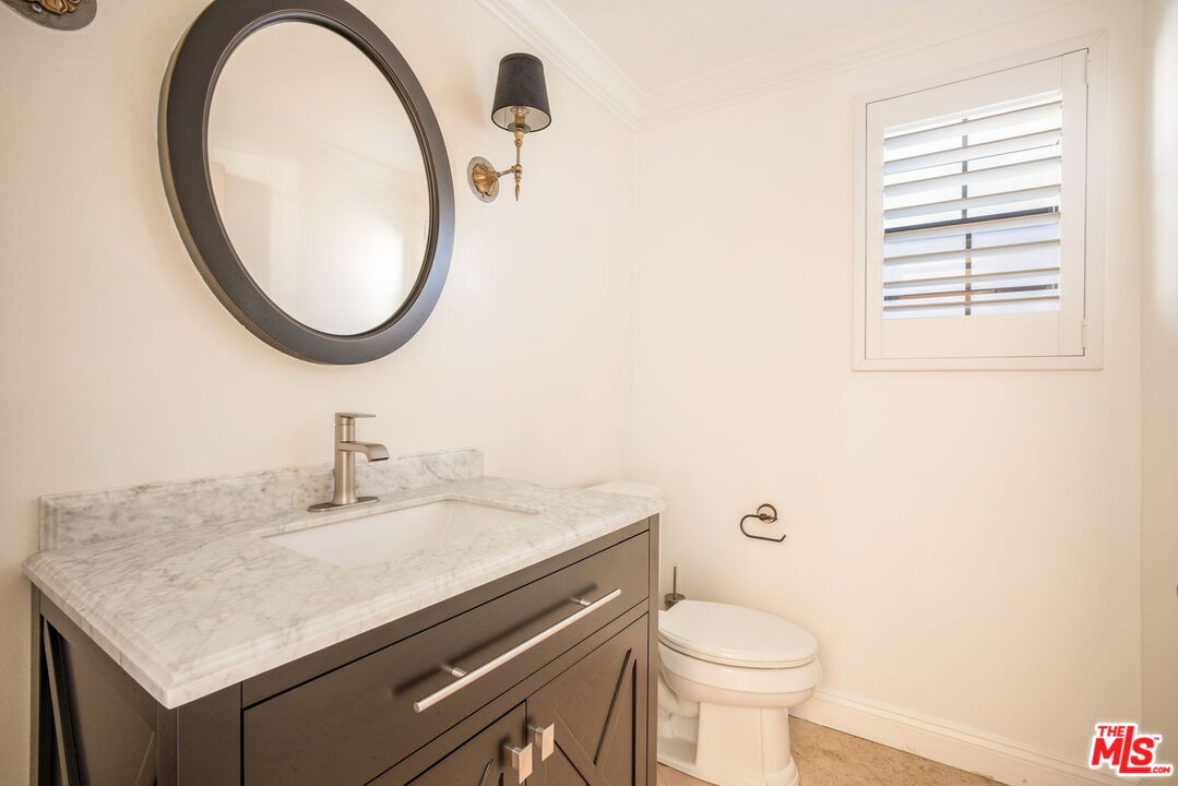 36 Navy Street, Unit 1 Venice, CA 90291 - Photo 15 of 49 a bathroom with a sink a toilet and a mirror