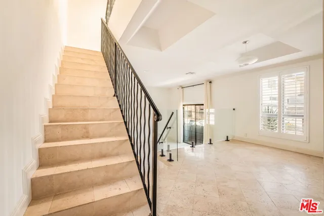 a view of staircase with white walls