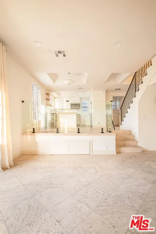 a spacious bathroom with a tub and shower
