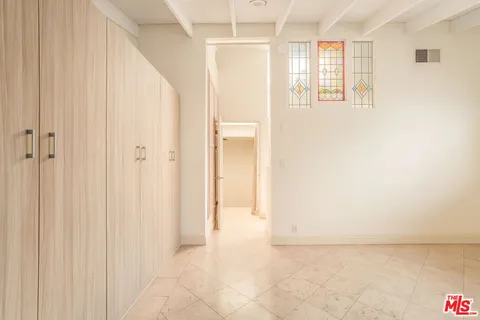 a bathroom with a double vanity sink toilet and mirror
