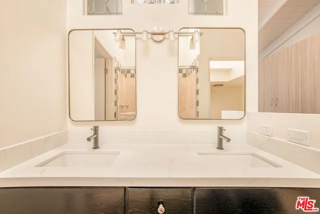 a bathroom with a shower and a bath tub
