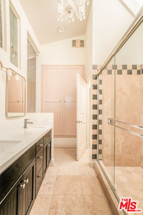 36 Navy Street, Unit 1 Venice, CA 90291 - Photo 34 of 49 a bathroom with a granite countertop sink a mirror and shower
