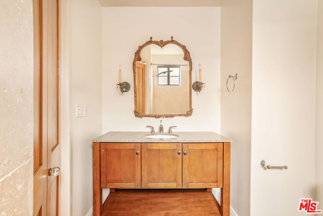 36 Navy Street, Unit 1 Venice, CA 90291 - Photo 40 of 49 a bathroom with a sink and a mirror