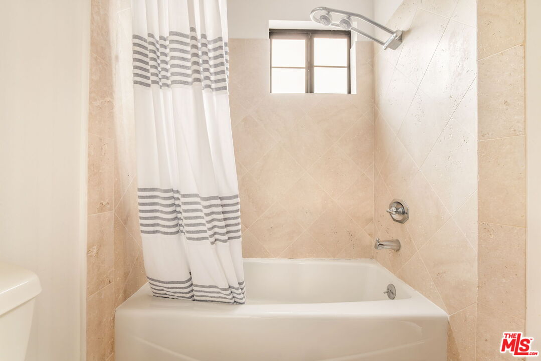 36 Navy Street, Unit 1 Venice, CA 90291 - Photo 41 of 49 a bathroom with a bathtub and shower