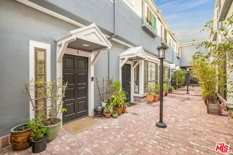 a front view of a house with parking space