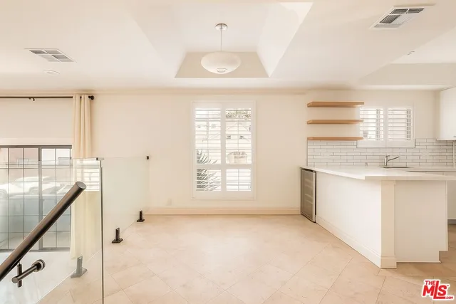 a view of a kitchen with a sink