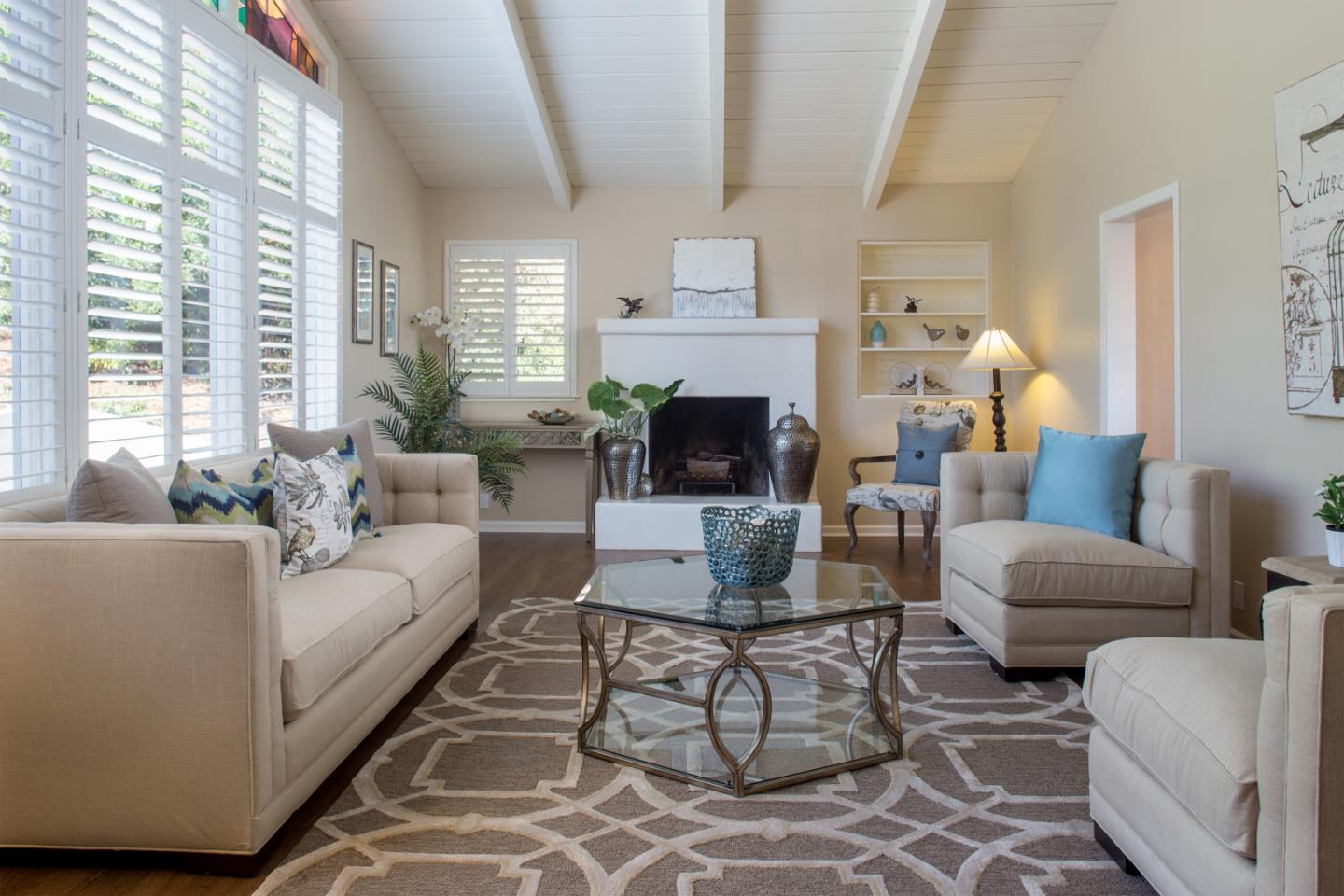 2925 Ribera Road Carmel, CA 93923 - Photo 4 of 27 a living room with furniture a fireplace and a large window