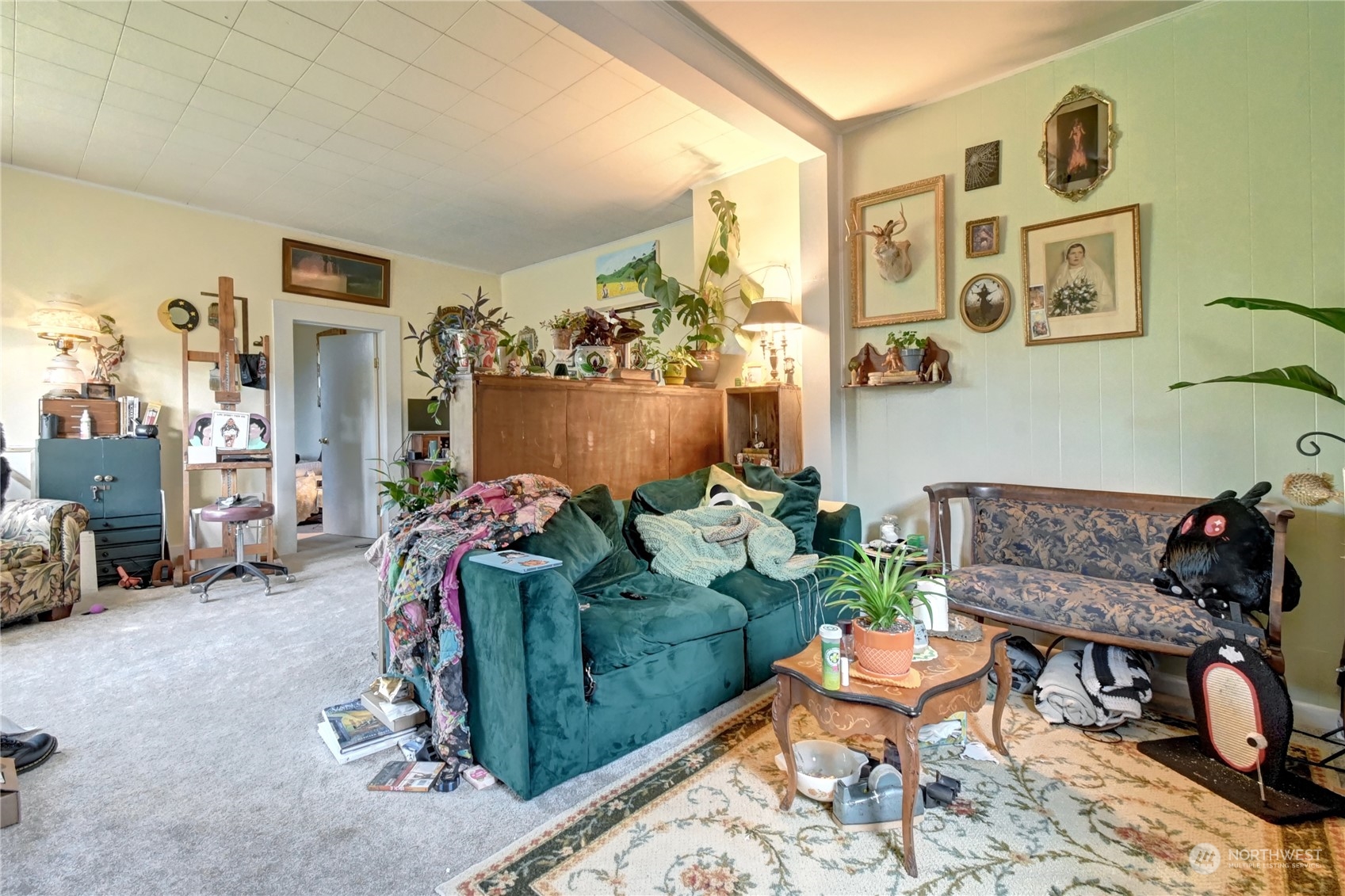 2223 Rockefeller Avenue Everett, WA 98201 - Photo 12 of 21 a living room with furniture and a floor to ceiling window