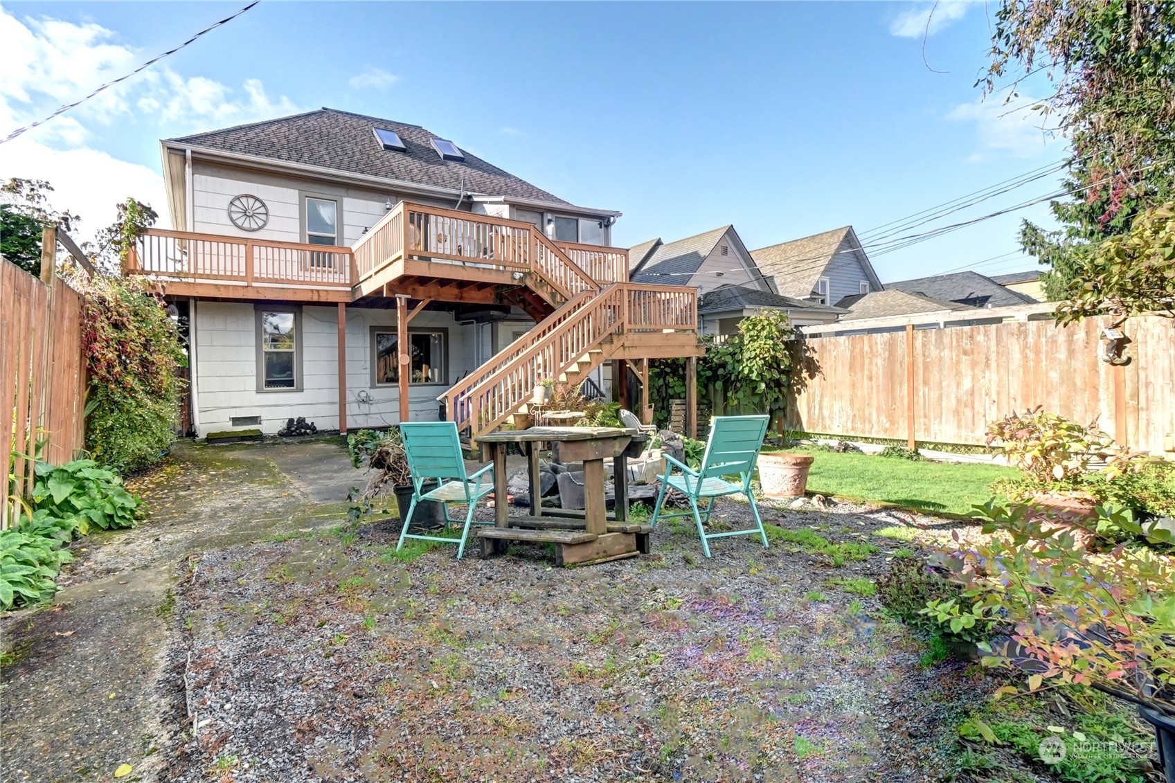 2223 Rockefeller Avenue Everett, WA 98201 - Photo 20 of 21 a view of a house with a yard and lawn chairs