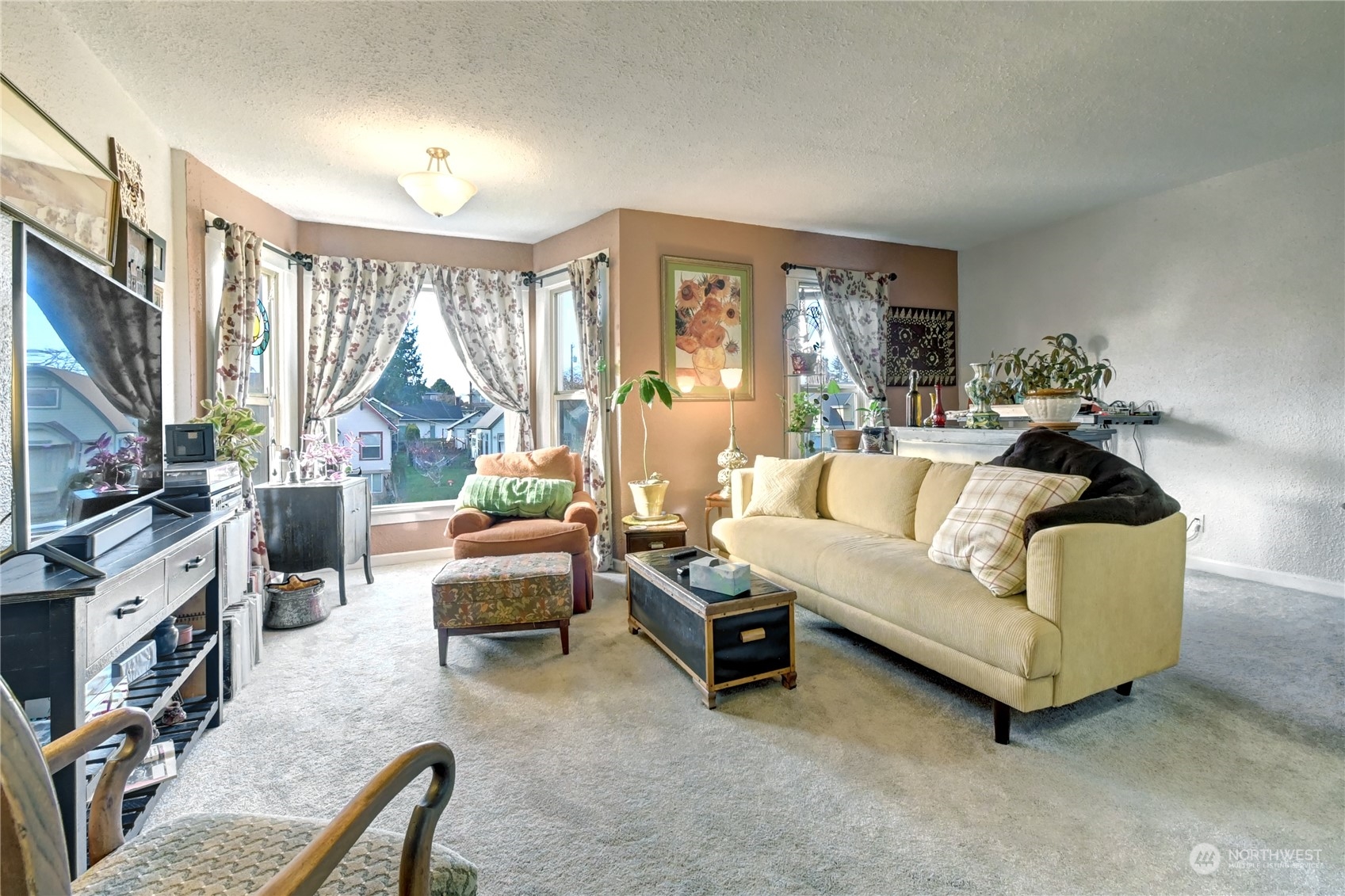 2223 Rockefeller Avenue Everett, WA 98201 - Photo 4 of 21 a living room with furniture a flat screen tv and a fireplace