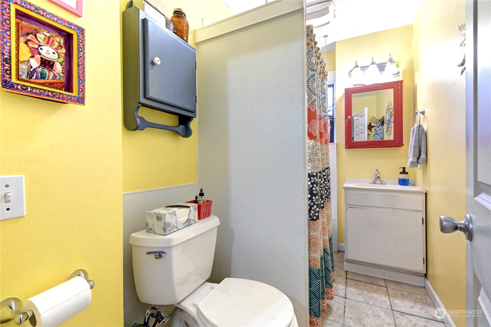 2223 Rockefeller Avenue Everett, WA 98201 - Photo 9 of 21 a bathroom with a sink mirror vanity and toilet