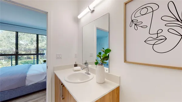 a bathroom with a sink and a mirror