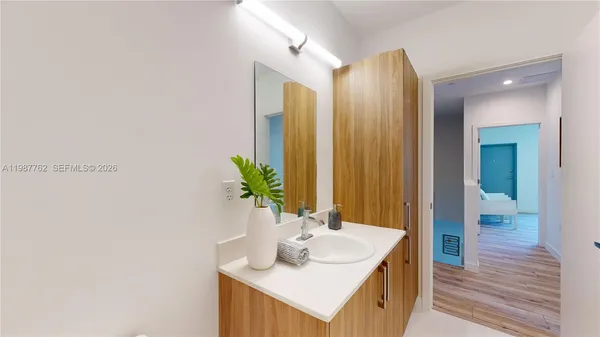 a bathroom with a sink and a mirror
