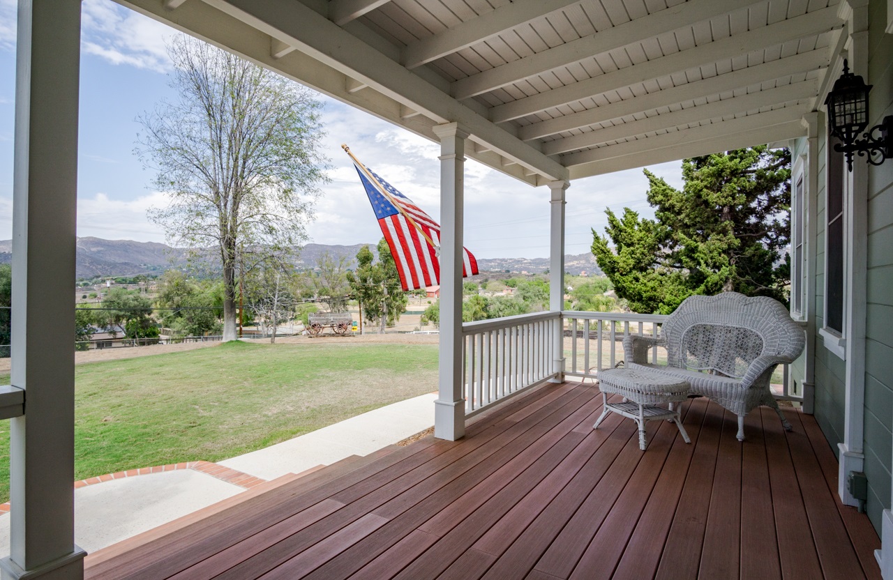 14095 Proctor Valley Road Jamul, CA 91935 - Photo 3 of 23 Wide and welcoming front porch made with Weatherbest decking and top-quality redwood railings
