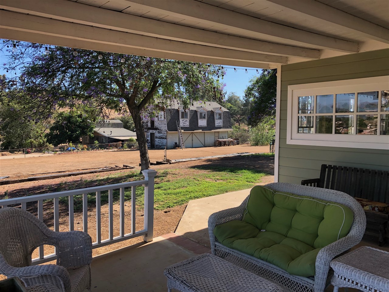 14095 Proctor Valley Road Jamul, CA 91935 - Photo 22 of 23 Back porch with barn in distance
