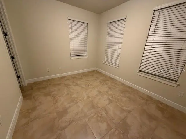 an empty room with windows