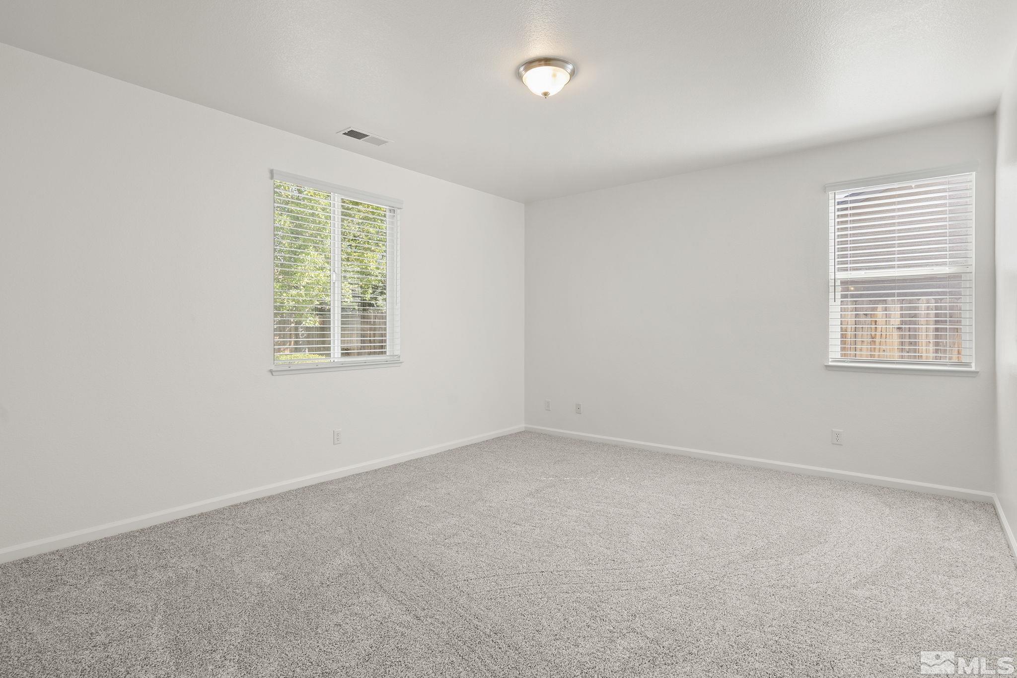 9130 Andraste Way Reno, NV 89506 - Photo 12 of 19 an empty room with windows