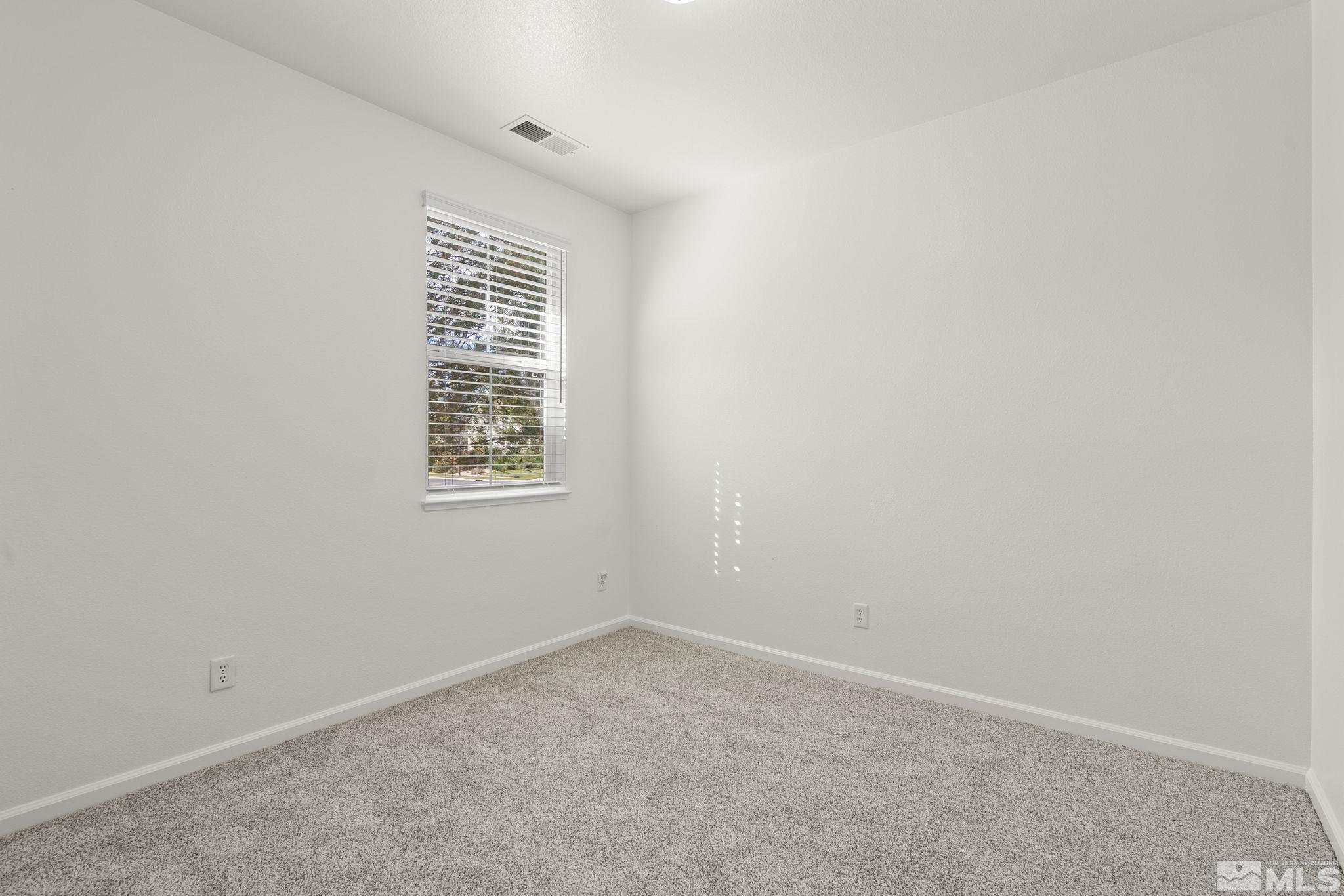 9130 Andraste Way Reno, NV 89506 - Photo 14 of 19 an empty room with windows