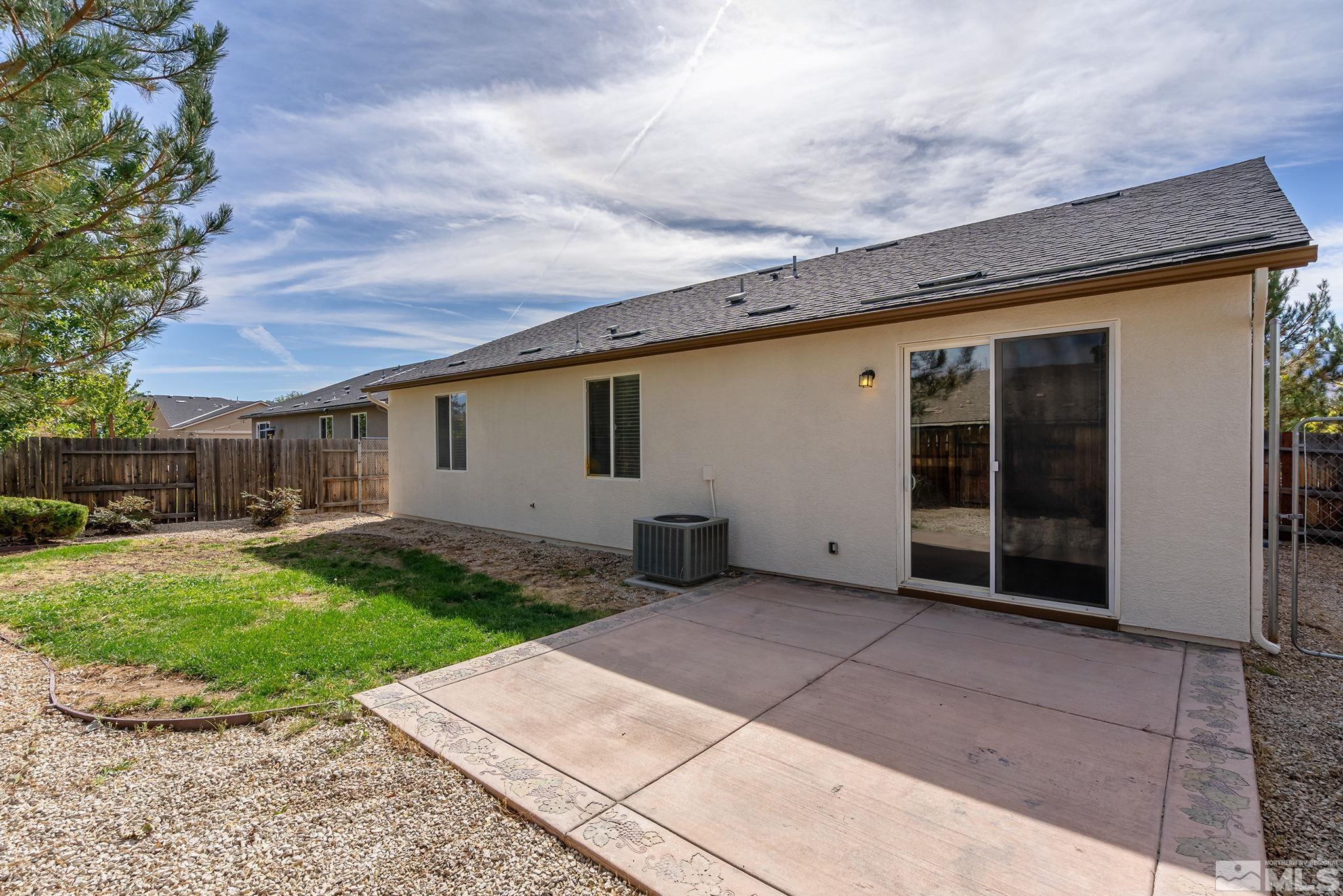 9130 Andraste Way Reno, NV 89506 - Photo 19 of 19 a backyard of a house with yard barbeque oven and outdoor seating