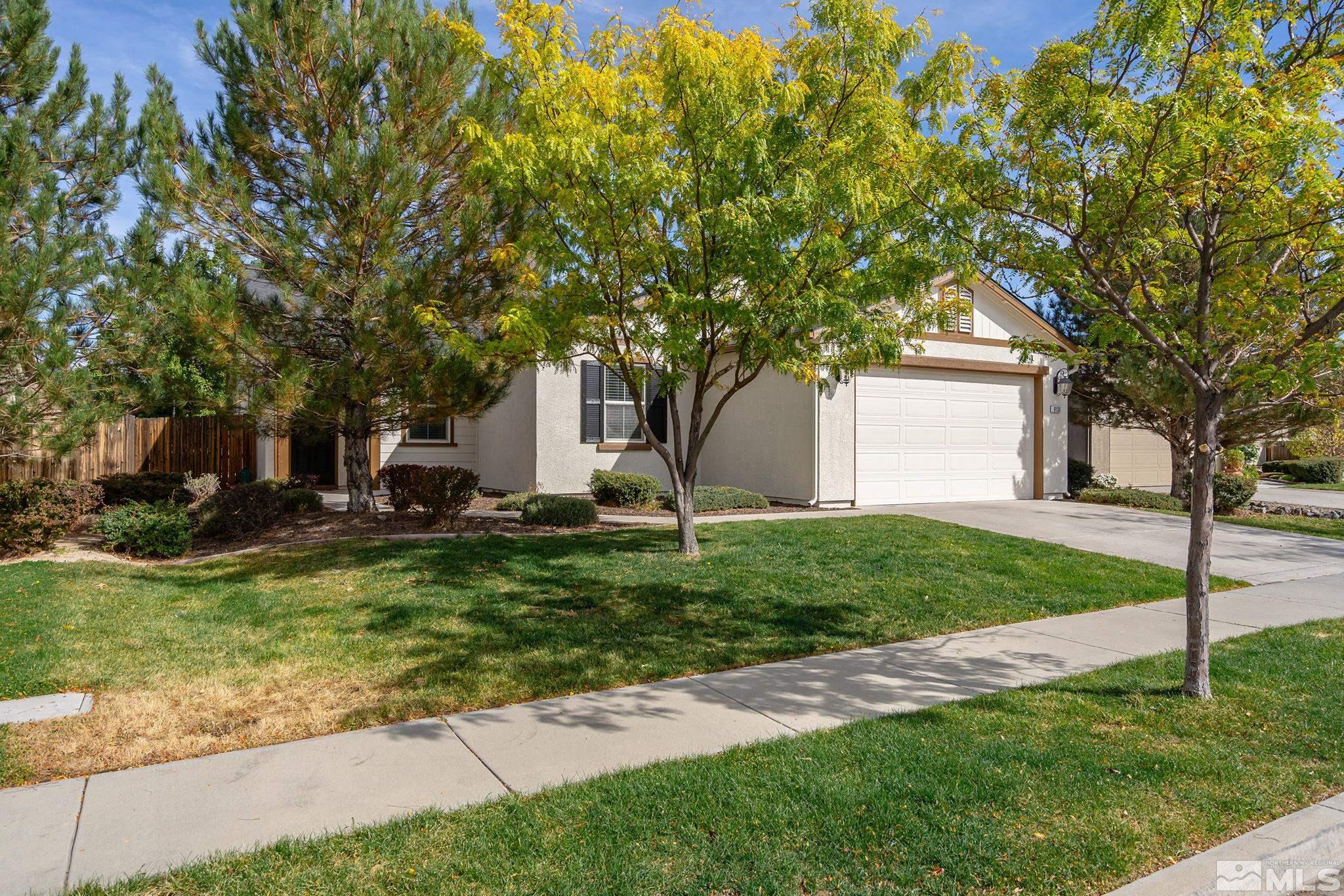 9130 Andraste Way Reno, NV 89506 - Photo 2 of 19 a view of a house with backyard and a tree