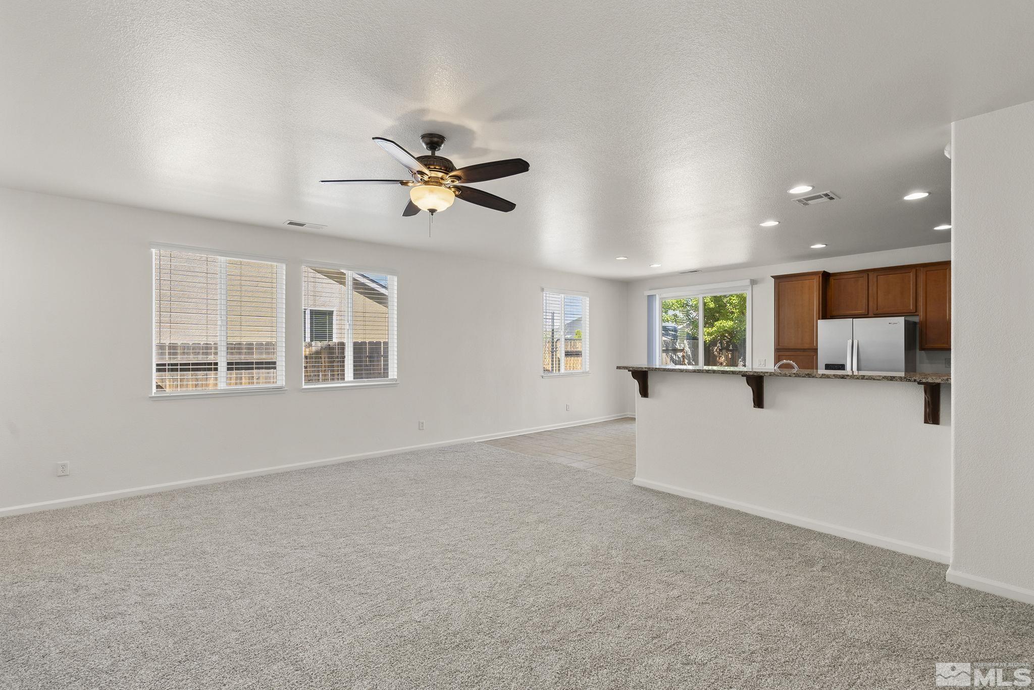 9130 Andraste Way Reno, NV 89506 - Photo 5 of 19 a view of an empty room with a window