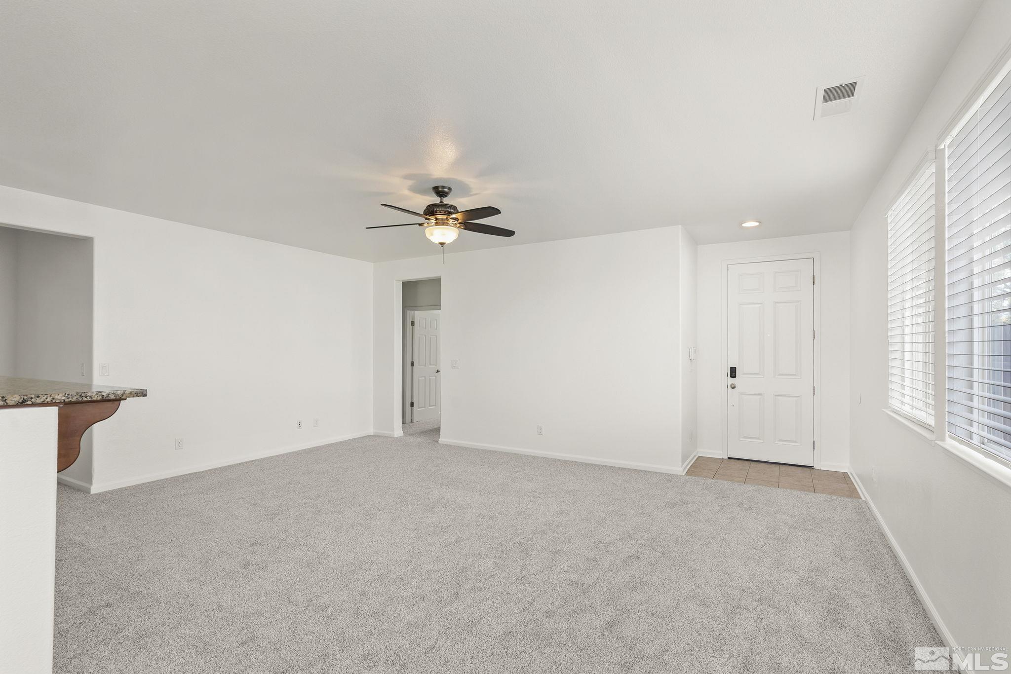9130 Andraste Way Reno, NV 89506 - Photo 7 of 19 a view of an empty room with a window