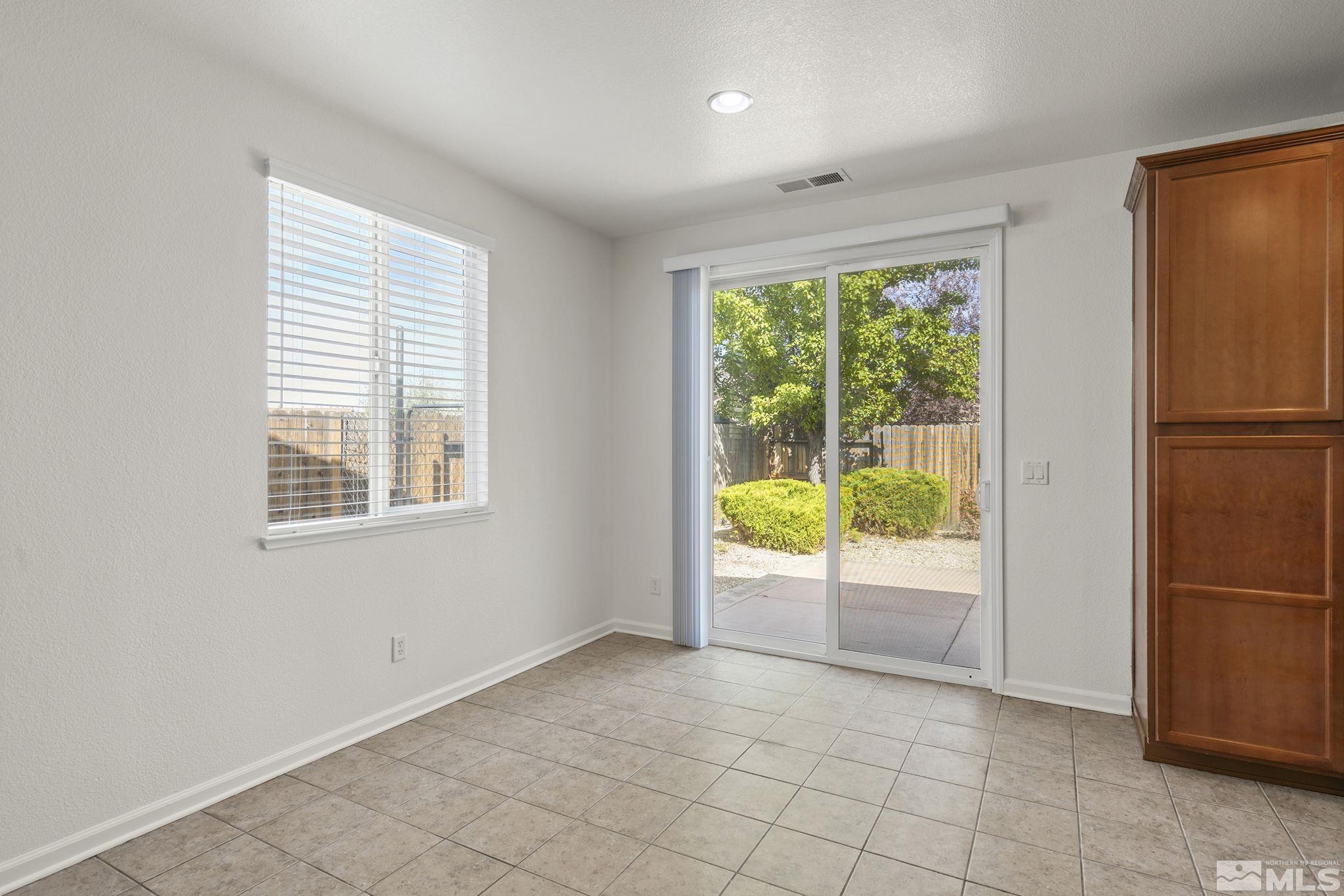 9130 Andraste Way Reno, NV 89506 - Photo 8 of 19 a view of an empty room with a window