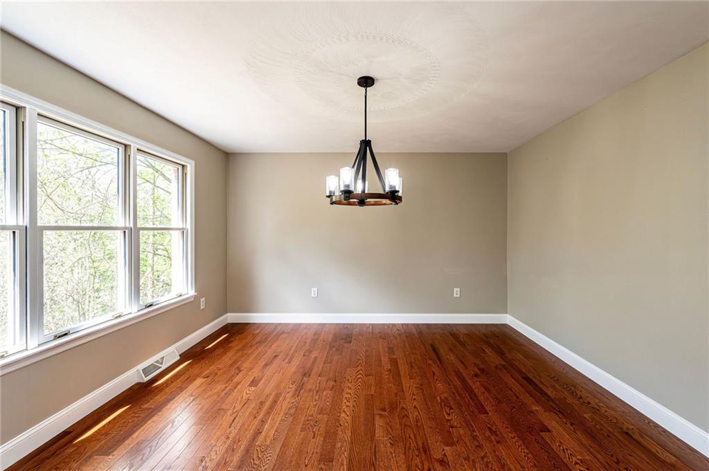 1120 Sandstone Road Greensburg, PA 15601 - Photo 17 of 43 a view of empty room with wooden floor and window