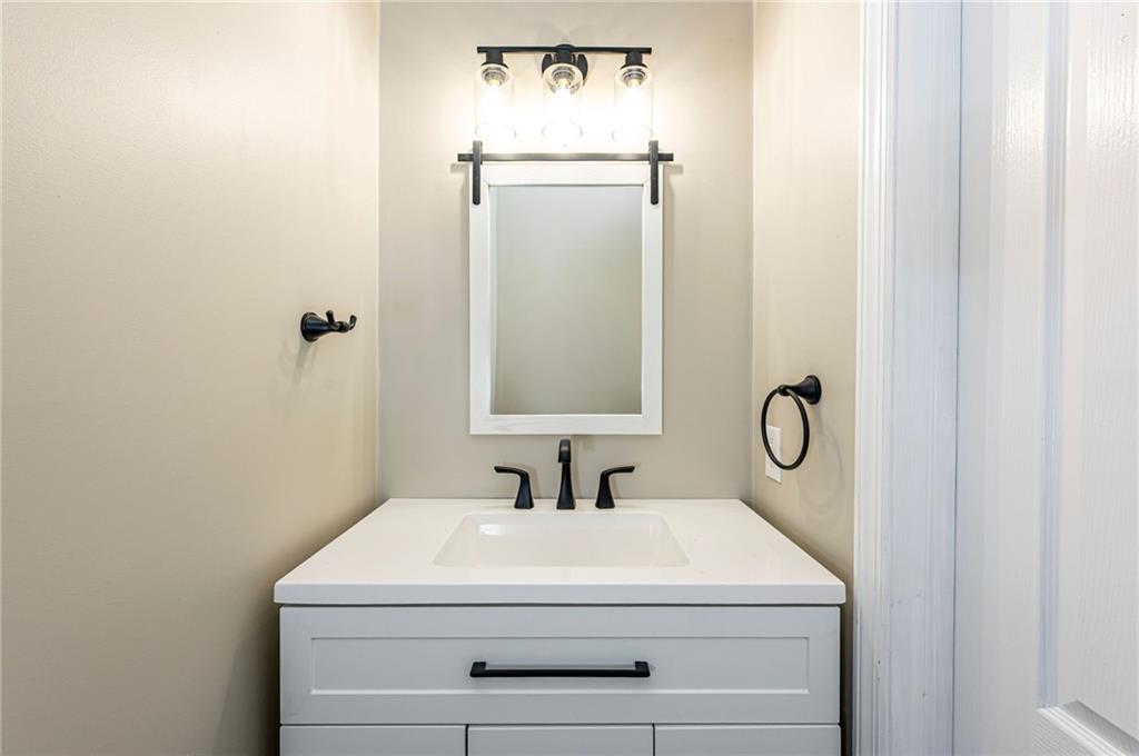 1120 Sandstone Road Greensburg, PA 15601 - Photo 21 of 43 a bathroom with a sink and a mirror