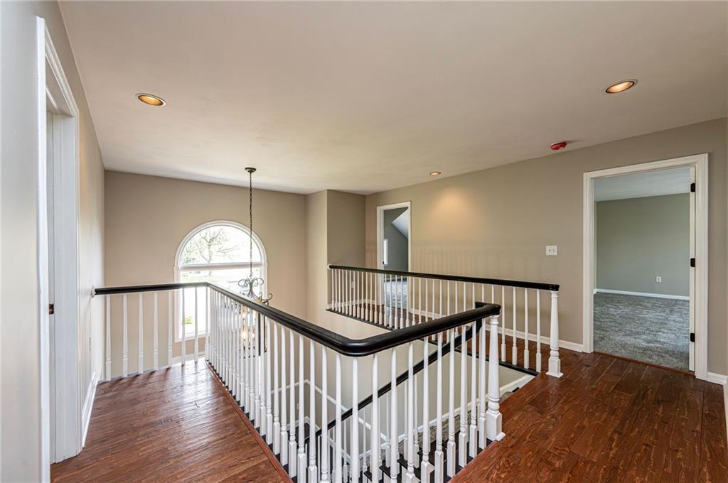 1120 Sandstone Road Greensburg, PA 15601 - Photo 22 of 43 a view of staircase with wooden floor and a window