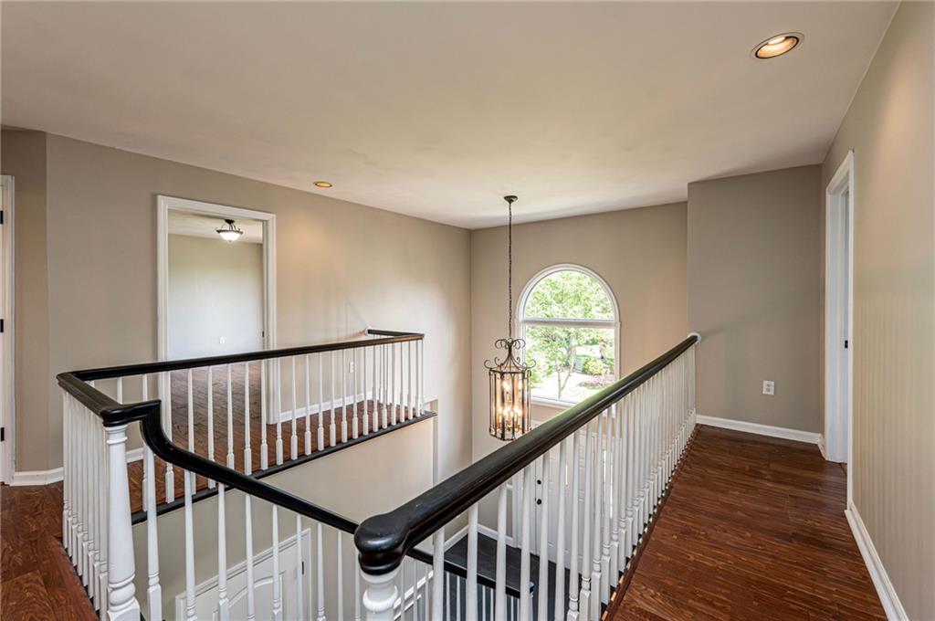 1120 Sandstone Road Greensburg, PA 15601 - Photo 23 of 43 a view of as hallway with wooden floor and stairs