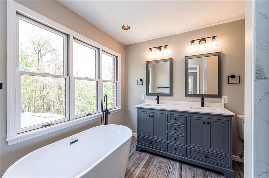 1120 Sandstone Road Greensburg, PA 15601 - Photo 27 of 43 a bathroom with a large tub sink and mirror