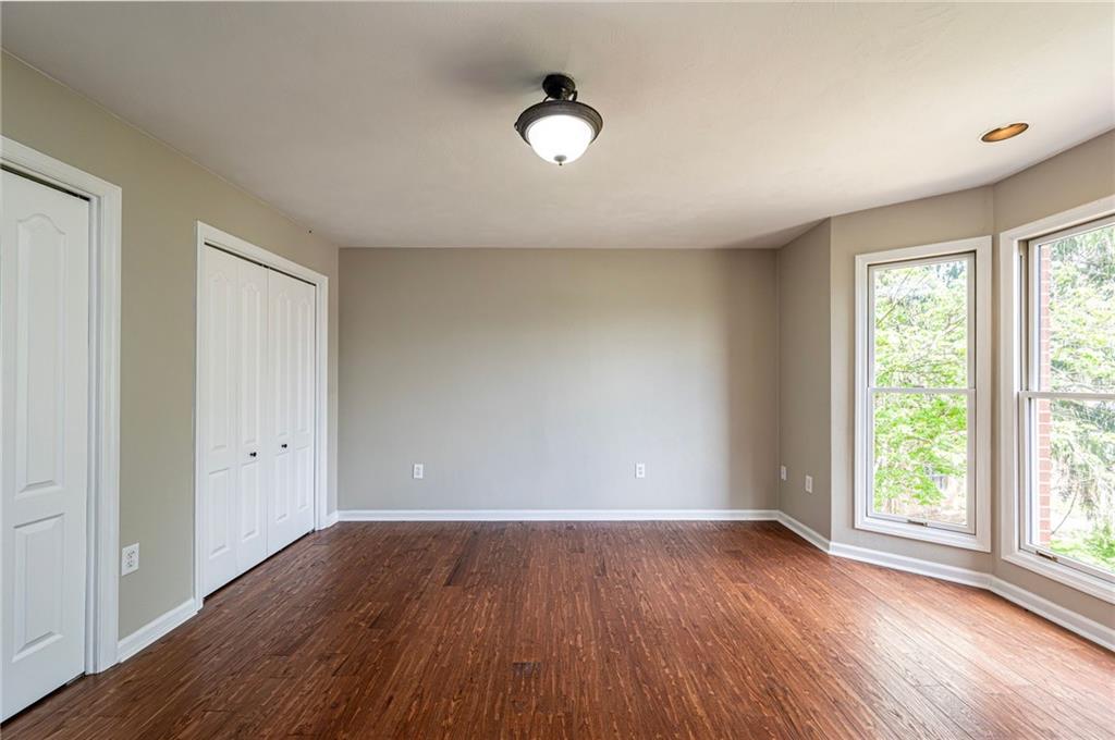 1120 Sandstone Road Greensburg, PA 15601 - Photo 30 of 43 an empty room with wooden floor and windows