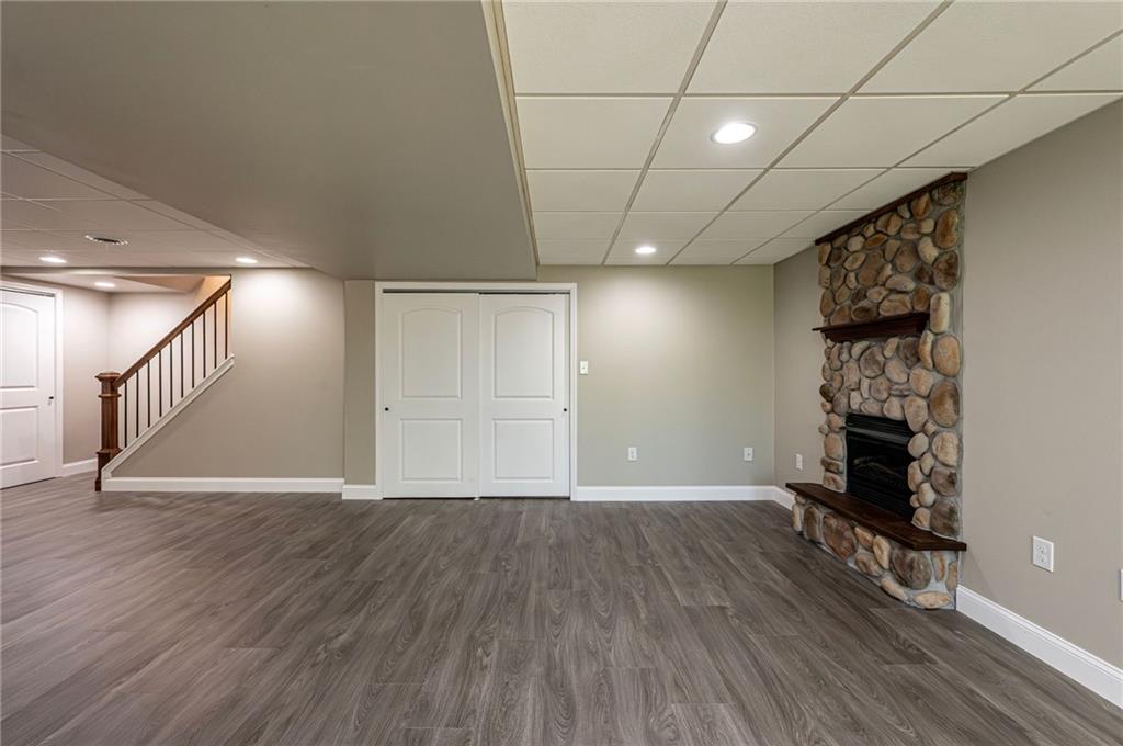1120 Sandstone Road Greensburg, PA 15601 - Photo 38 of 43 a view of empty room with wooden floor and fireplace