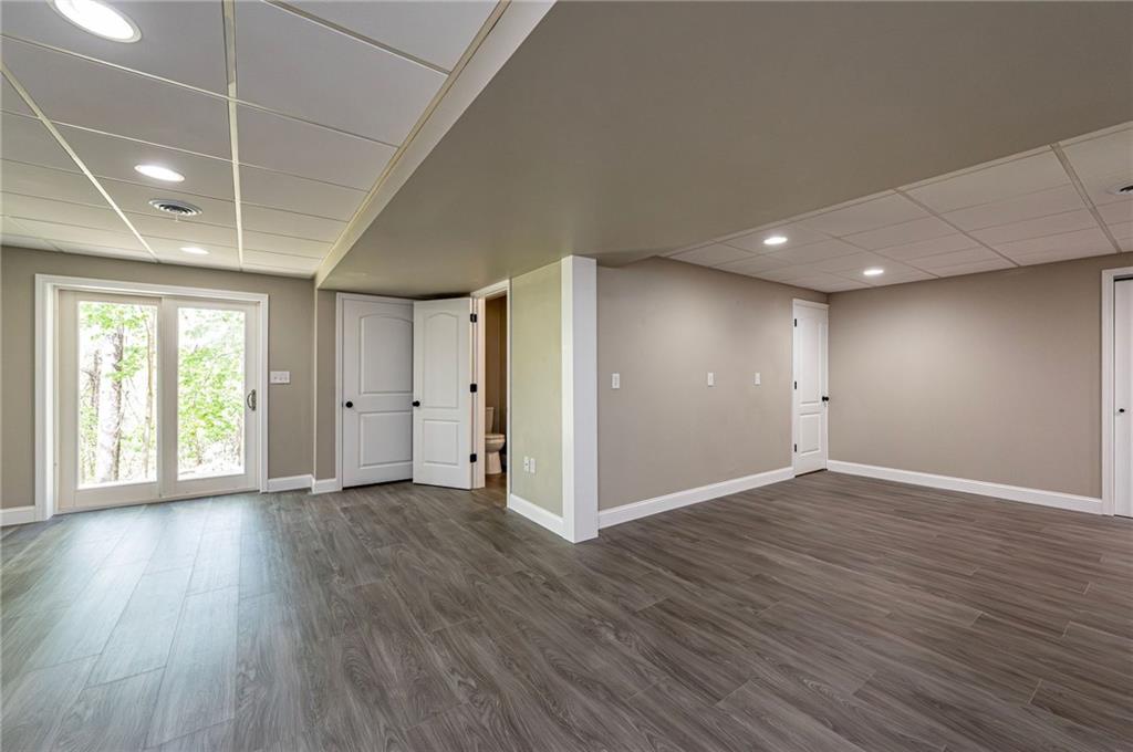 1120 Sandstone Road Greensburg, PA 15601 - Photo 39 of 43 an empty room with wooden floor and windows