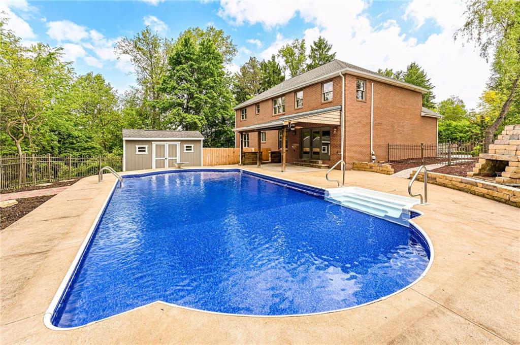 1120 Sandstone Road Greensburg, PA 15601 - Photo 9 of 43 a view of a house with swimming pool