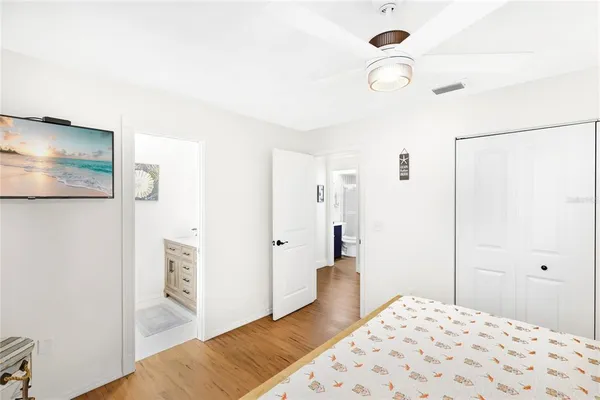 a bedroom with a bed and a view of bathroom