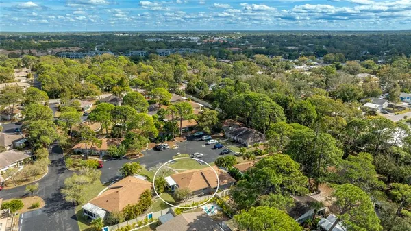 an aerial view of residential houses with outdoor space
