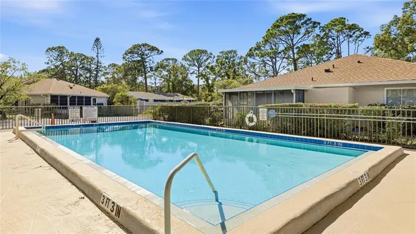 a view of a swimming pool with a patio