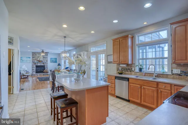 a view of a dining room with furniture wooden floor and chandelier