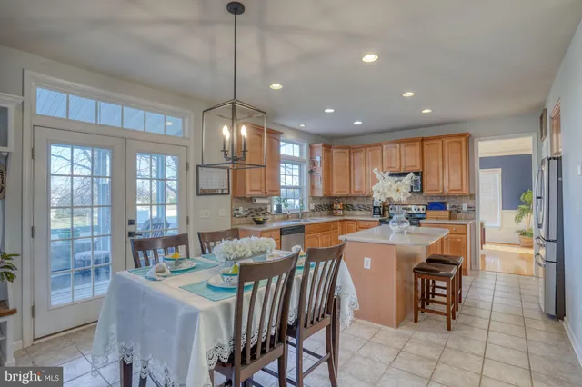 a living room with furniture a flat screen tv and a window