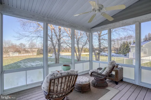 a spacious bedroom with a bed and a table in it