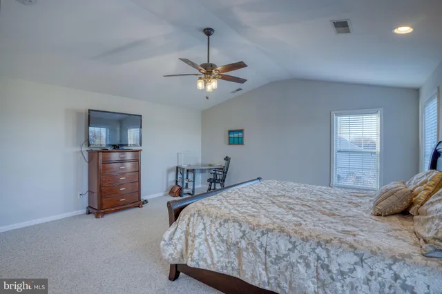 a view of a storage and utility room with washer and dryer