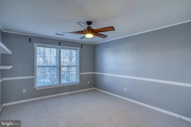 a room with table chairs and cabinets