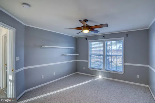 a view of walk in closet with clothes