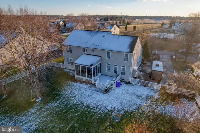 an aerial view of a house with patio