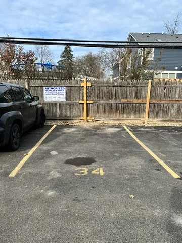 a view of a car park in front of a building