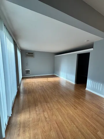 a view of livingroom with wooden floor