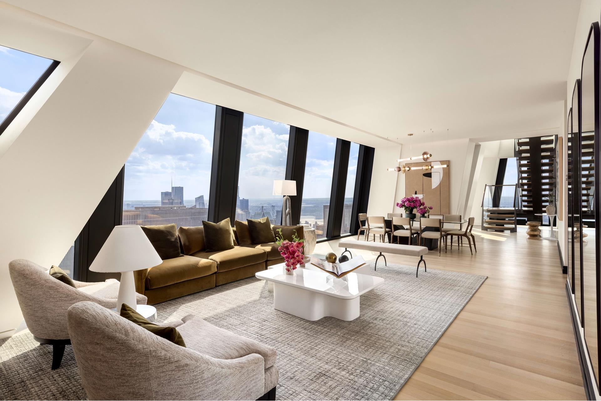 53 West 53rd Street, Unit 72B Manhattan, NY 10019 - Photo 5 of 39 a living room with furniture and floor to ceiling window