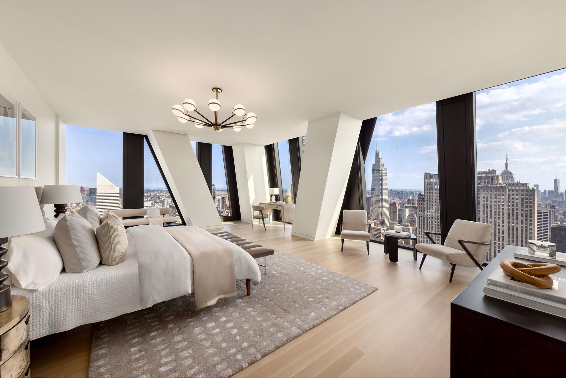 53 West 53rd Street, Unit 72B Manhattan, NY 10019 - Photo 7 of 39 a bedroom with furniture and a large window